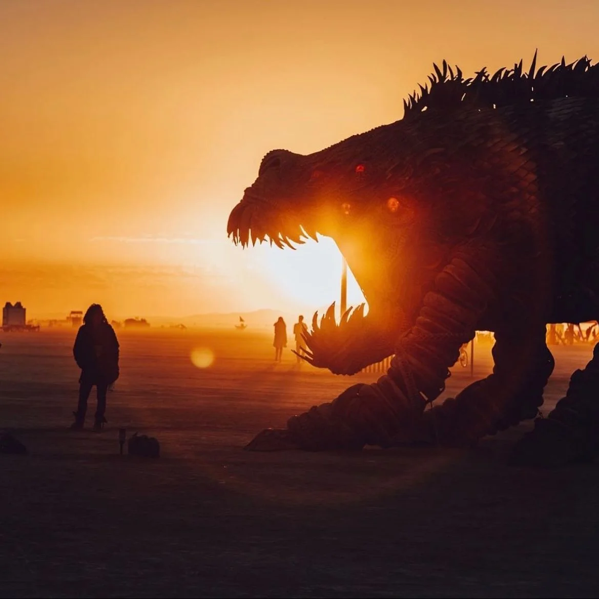 Golden hour silhouette of the Fearbeast's profile against sunset sky
